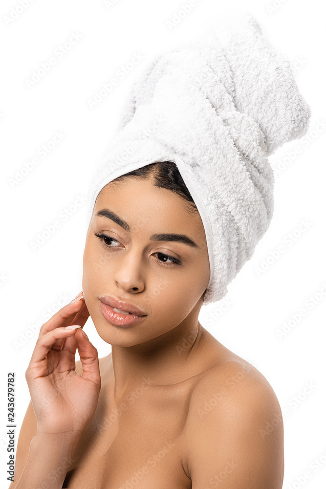 pensive naked african american woman with towel on head touching face and looking away isolated on white pensive naked african american woman with towel on head touching face and looking away isolated on white