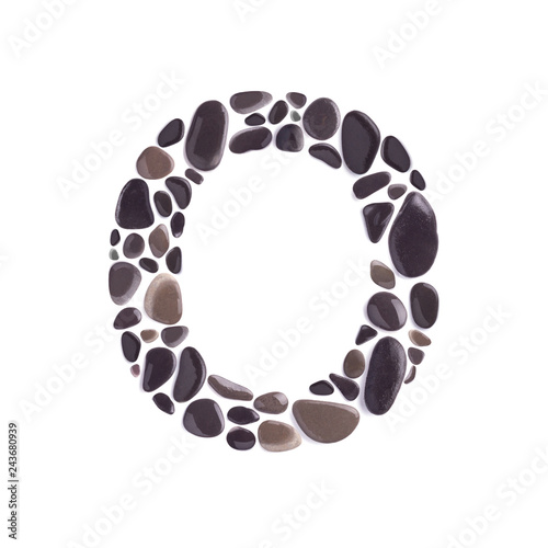 O Letter made of black beach stones isolated on white background