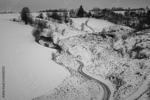 Landscape with road at winter on Ponidzie near Stradow, Swietokrzyskie, Poland