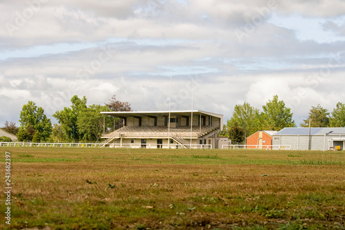 Empty rugby field with tribune photo