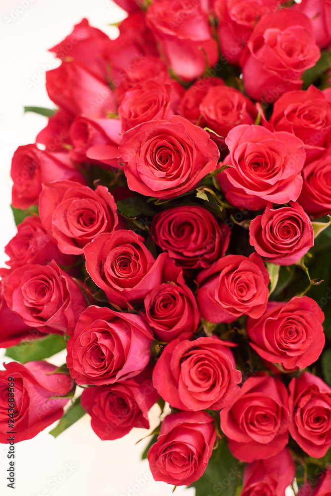 Fresh cut red roses and arrangements in florist shop, tracking shot Fresh cut red roses and arrangements in florist shop, tracking shot