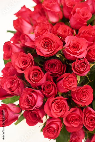 Fresh cut red roses and arrangements in florist shop  tracking shot