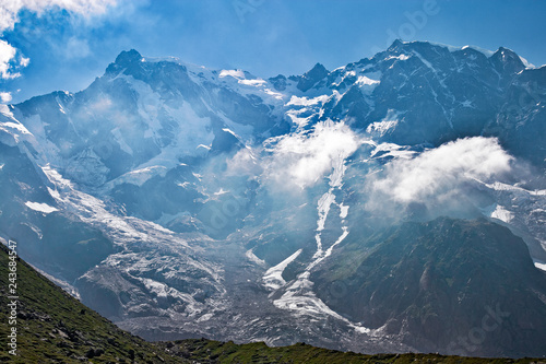 Panoramic view of the imposing east face of Monte Rosa against the light, above Macugnaga in Piedmont, Italy. photo