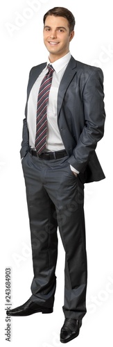 Portrait of young businessman in black suit isolated on white