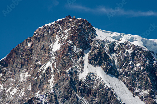 Panoramic view of Gnifetti peak with the Margherita hut, in the imposing east face of Monte Rosa above Macugnaga in Piedmont, Italy. photo