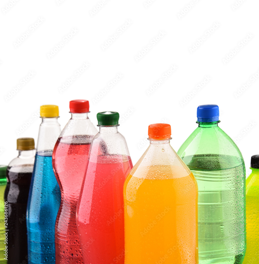 Plastic bottles of assorted carbonated soft drinks over white Plastic bottles of assorted carbonated soft drinks over white