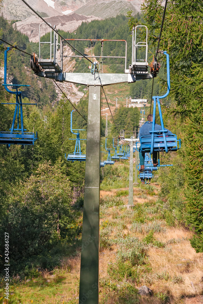 Chair lift that climbs to the lookout point on the slopes of Monte Rosa above Macugnaga in Piedmont, Italy Chair lift that climbs to the lookout point on the slopes of Monte Rosa above Macugnaga in Piedmont, Italy