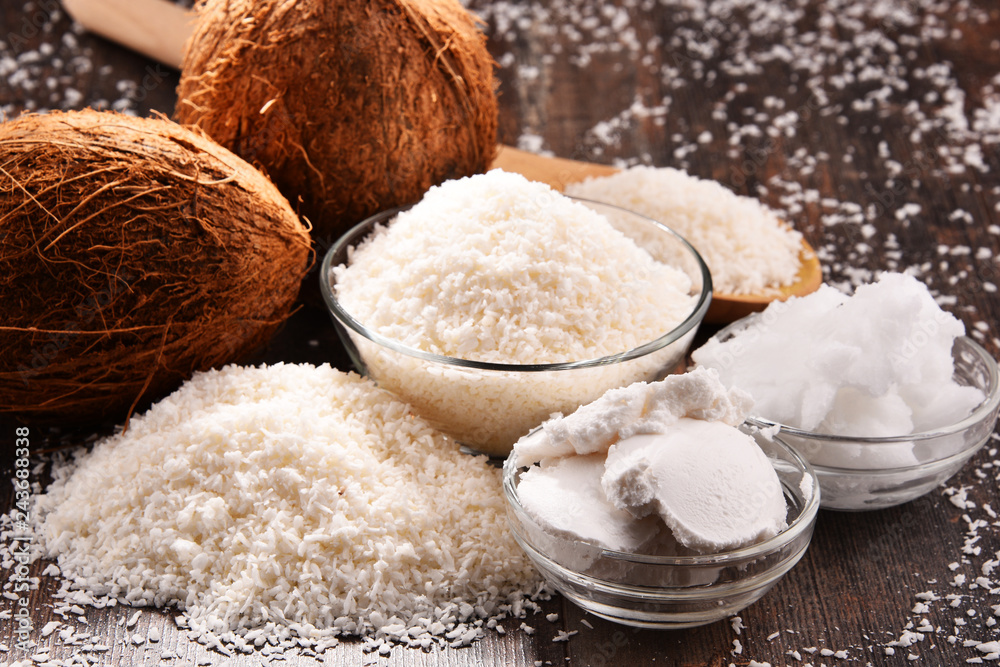 Composition with bowl of shredded coconut and shells Composition with bowl of shredded coconut and shells