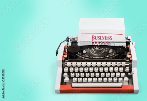 Old typewriter with paper on background