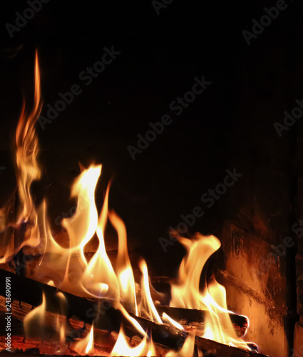 Flames of fire on a black background. The mystery of fire. Space for copy, text, your words. Vertical