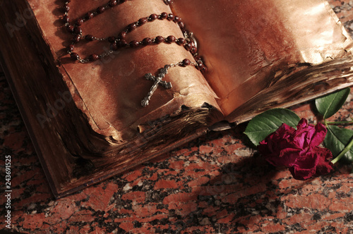 Old book and crucifix.