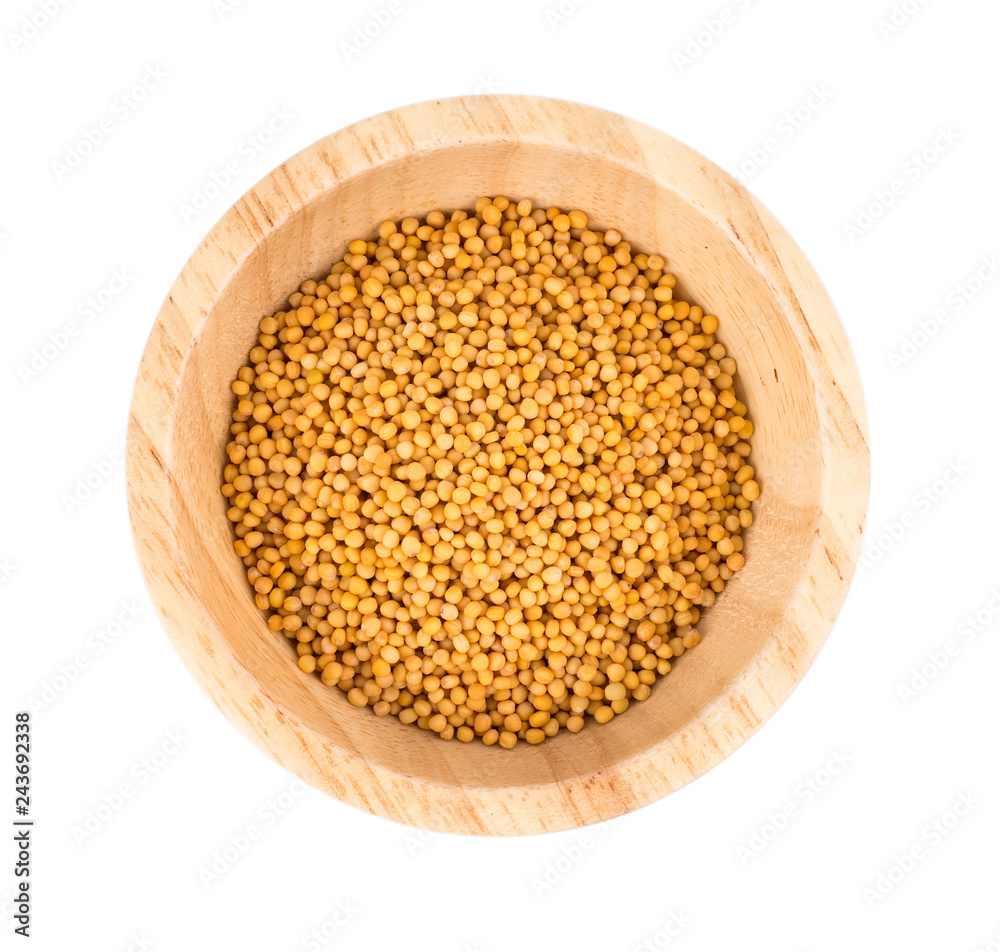 mustard seeds in bowl isolated on white background mustard seeds in bowl isolated on white background