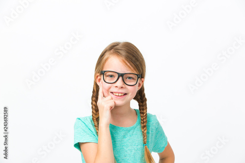 pretty girl with black glasses and plaits in front of white background in the studio