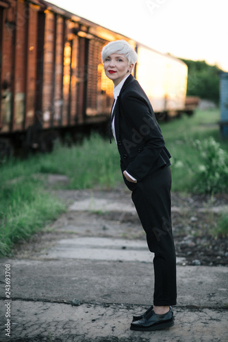 beautiful businness woman fashion portrait in classic costume and red lips © Anton