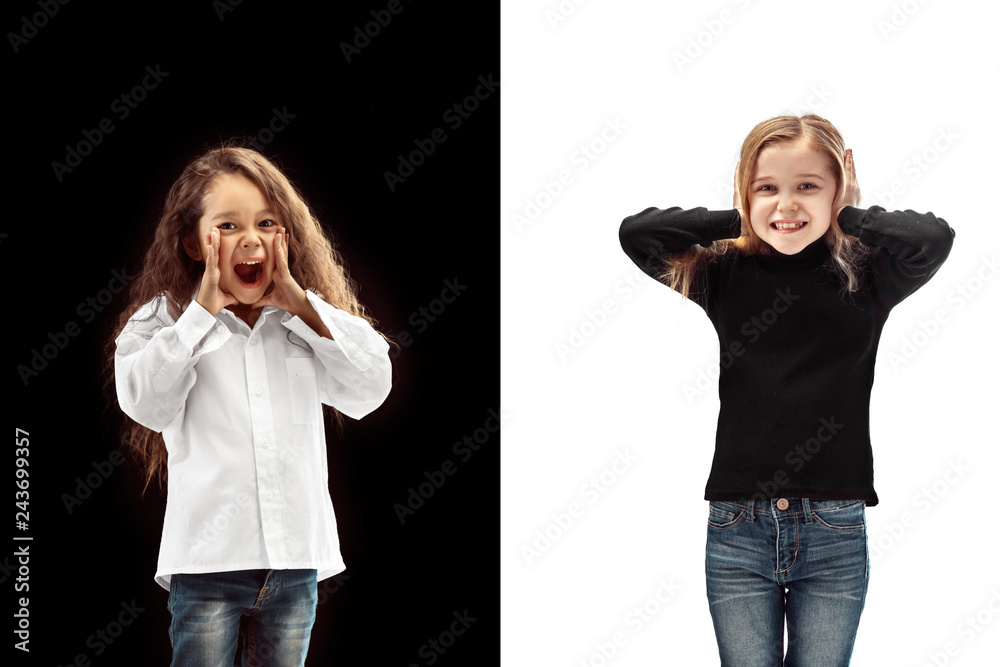 The portrait of two happy screaming girls on a white and black studio background. Human emotions concept. Comparison. The childhood, smile, happiness, joy, kid, friendship concept The portrait of two happy screaming girls on a white and black studio background. Human emotions concept. Comparison. The childhood, smile, happiness, joy, kid, friendship concept