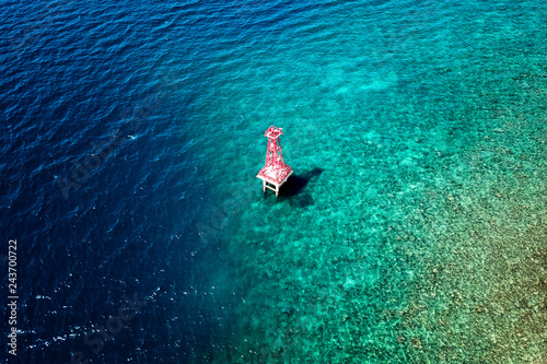 Aerial view of a Small light house, Badas harbor, Sumbawa, Indonesia photo