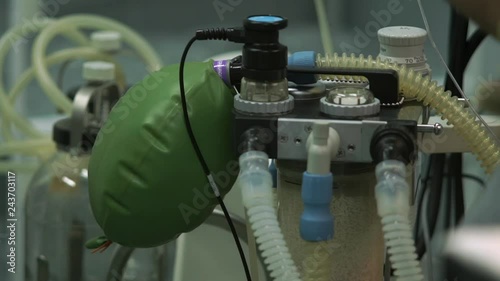 modern artificial lung with balloon and pipes operates in brightly lit surgery room at operation 