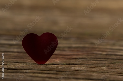 Heart shape decoration on wooden plank