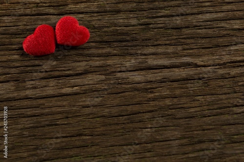 Heart shape decorations on wooden plank