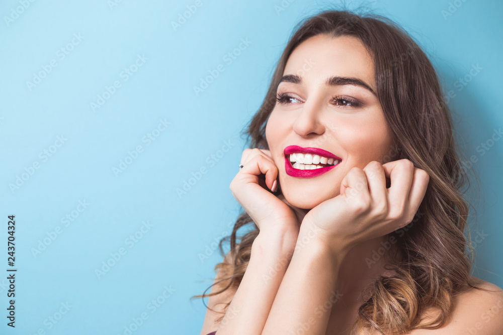 Smiling woman with beautiful white teeth. Portrait of a happy girl with clean skin and smooth teeth.  - obrazy, fototapety, plakaty 