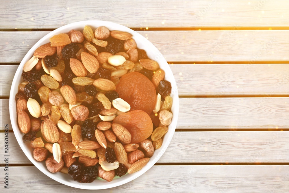 Large diversity of healthy nuts on background Large diversity of healthy nuts on background