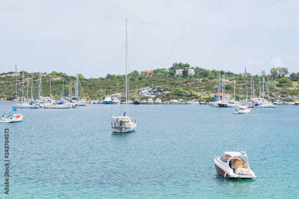 Obraz premium A lot of sailboats anchored in a port outside the city
