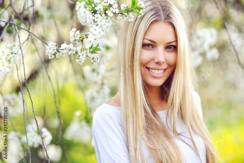 Face of a beautful young blodne woman in a green park - close up © paultarasenko