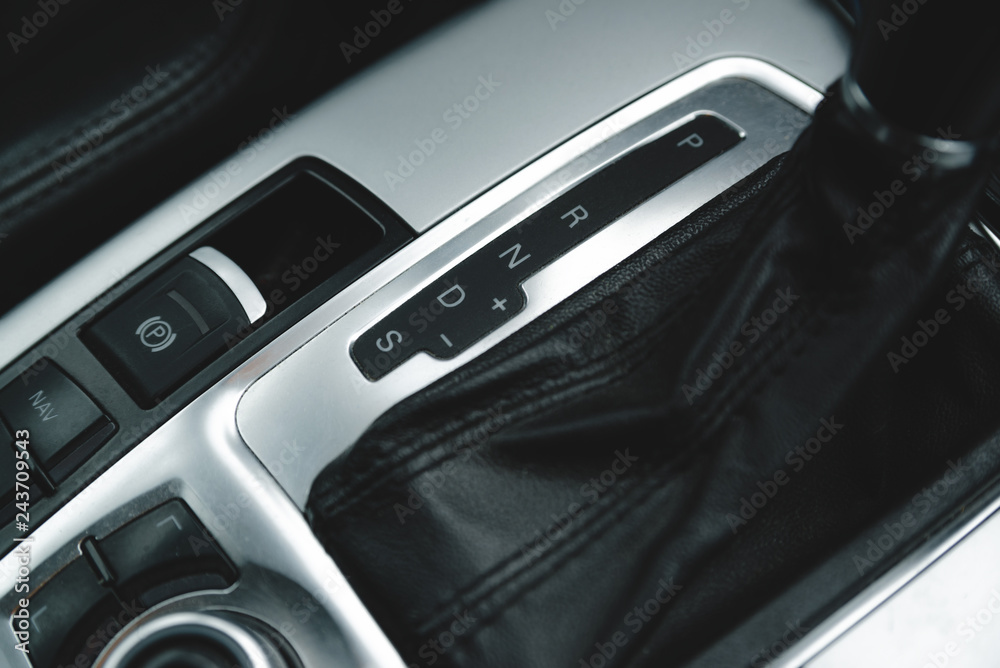 Automatic gear stick inside modern luxury car