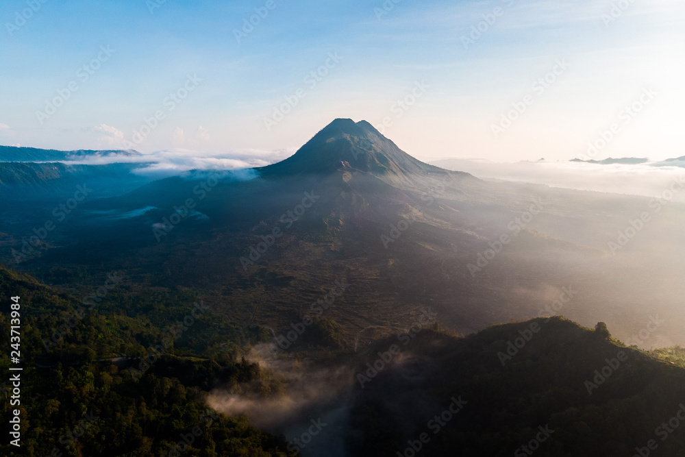 beautiful view sunrise and mist at Batur volcano, Kintamani, Bali, Indonesia. Sunrise view of Batur volcano, Bali island, Indonesia. Bali volcano. Bali nature landscape