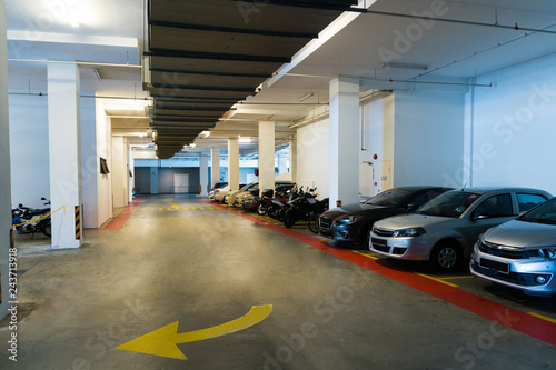 Building underground parking lot with few cars photo