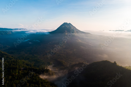 beautiful view sunrise and mist at Batur volcano, Kintamani, Bali, Indonesia. Sunrise view of Batur volcano, Bali island, Indonesia. Bali volcano. Bali nature landscape
