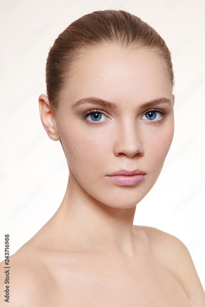 Fototapeta premium Portrait of young beautiful girl with clean make-up