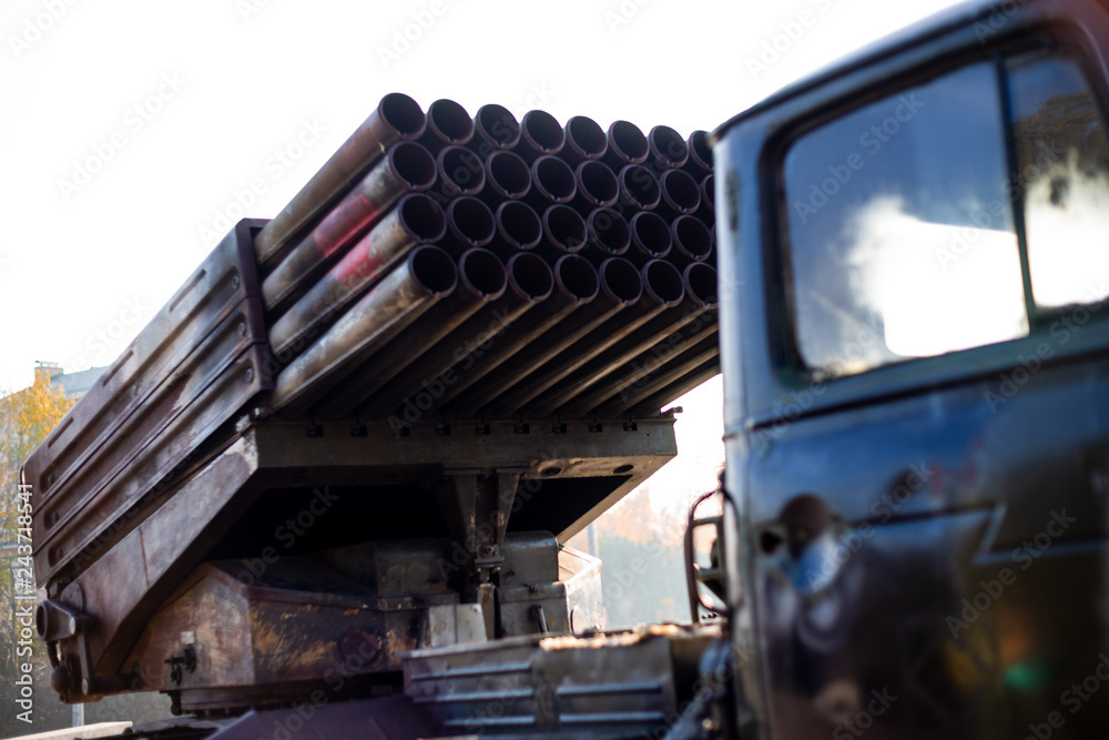 Camouflage military truck with rocket launcher. Outdoor military ...
