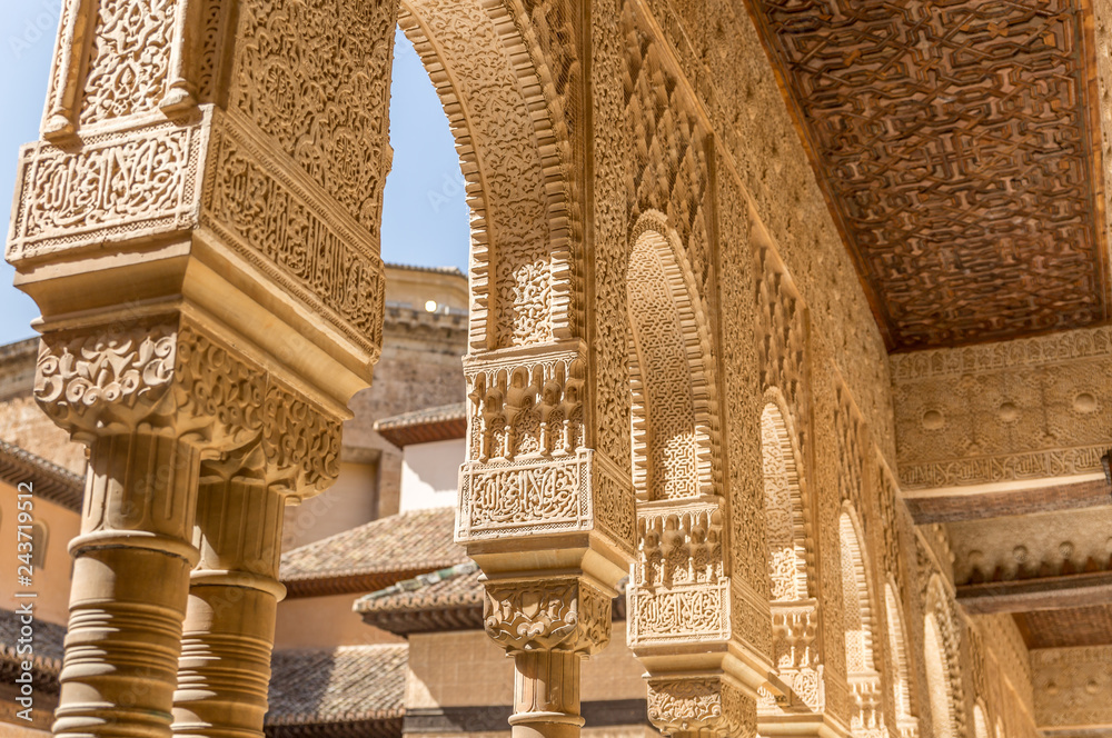 Arabesques and Mocarabe Stalactites at the courtyard of the Lions at Nasrid Palaces Alhambra Granada, Andalusia Arabesques and Mocarabe Stalactites at the courtyard of the Lions at Nasrid Palaces Alhambra Granada, Andalusia