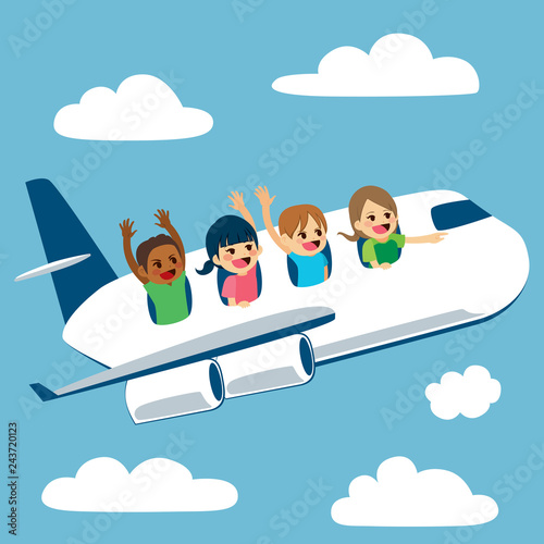 Four cute little children traveling with plane on school trip