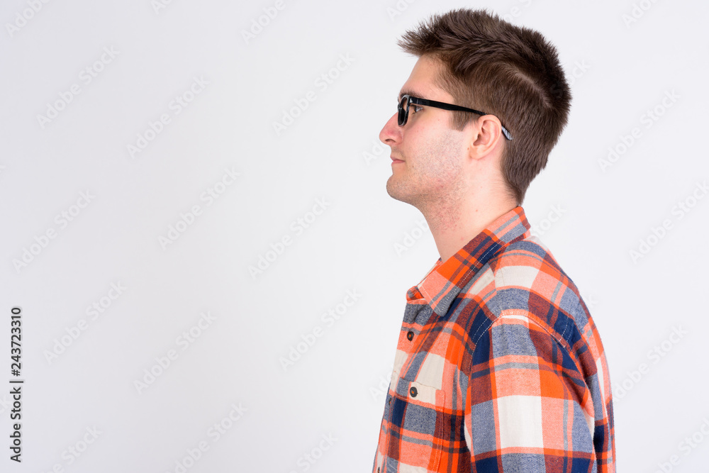 Closeup profile view of young handsome man with eyeglasses Closeup profile view of young handsome man with eyeglasses