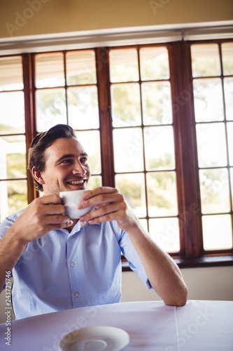 Man having coffee in restaurant