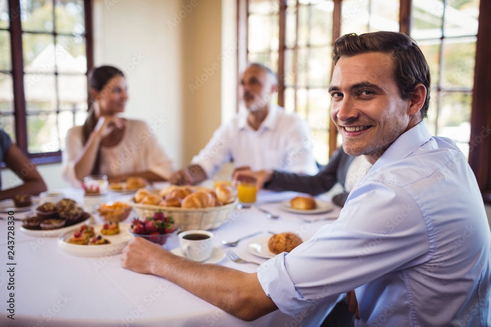 Businessman looking at camera in restaurant Businessman looking at camera in restaurant