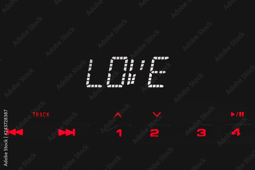 Word Love on car radio display. Concept of Valentine day