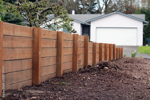 Horizontal sturdy retaining wall in yard for erosion and separation
