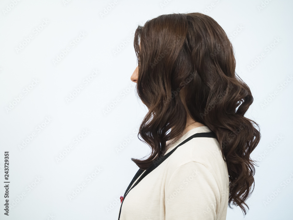 Obraz premium Curly brown hair.