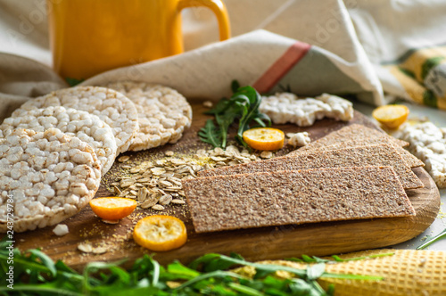 Round crispy rice crackers and Rye Crackers whith kumquat. Dietary concept and healthy vegetarian food. 