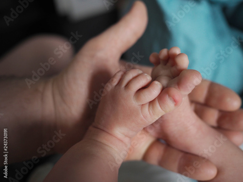children's legs and mother's hands