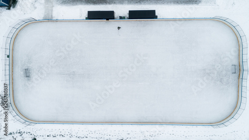 Photography Ice Hockey Rink. Boy playing ice hockey alone.