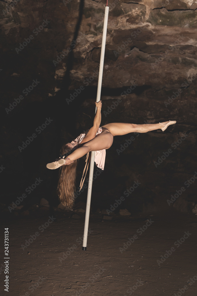 Fototapeta premium Woman practicing pole dance