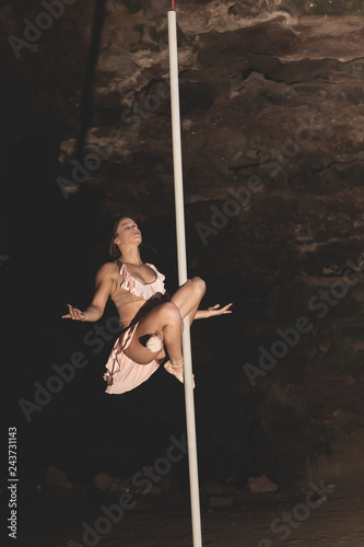 Woman practicing pole dance