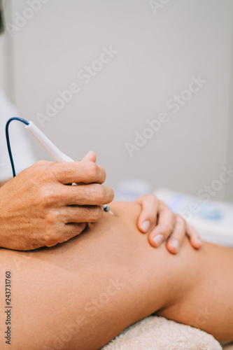 Electroacupunture dry needling needle connecting machine to needles used by acupunturist on patient for acupunture guided by EPI Intratissue Percutaneous Electrolisis. photo