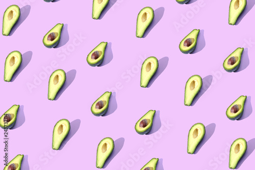 Many halves of avocado  pattern  banner. Billet bright background  pink purple pastel color.