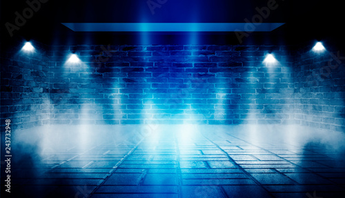 Background of empty dark room with brick walls, illuminated by neon blue lights with laser beams, smoke