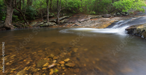 River flowing over rocks and the Debengeni Waterfall